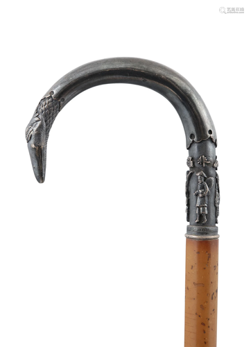 A VERY FINELY CHISELED SILVER HILTED WALK STICK WITH AN INSC...