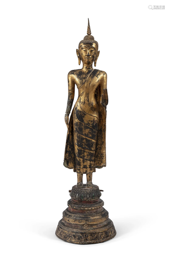 A MONUMENTAL GILT LACQUERED BRONZE FIGURE OF A STANDING BUDD...