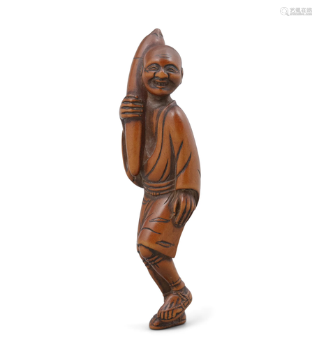 A CARVED BOXWOOD NETSUKE OF A MAN HOLDING AN EGGPLANT POSSIB...