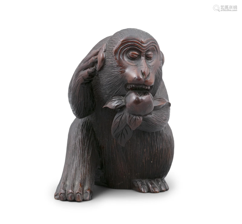 A WOOD CARVING OKIMONO OF A MONKEY (SARU) BITING A PEACH JAP...