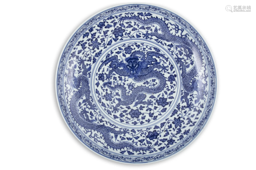 A LARGE MING-STYLE BLUE AND WHITE PORCELAIN ‘DRAGON’ SHALLOW...