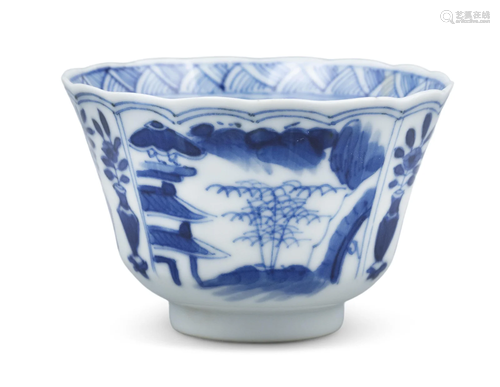 A BLUE AND WHITE PORCELAIN ‘LANDSCAPES AND FLOWERS’ CUP OF F...