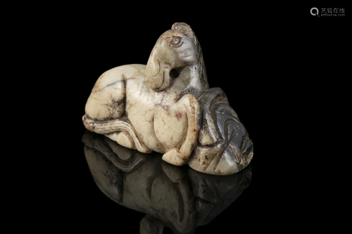 A CHICKEN BONE JADE CARVING OF A RECUMBENT HORSE CHINA, POSS...