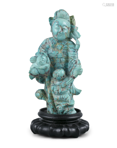 A TURQUOISE MATRIX CARVING OF A LADY WITH TWO BOYS AND A LOT...