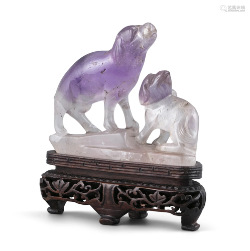 AN AMETHYST GROUP CARVING OF ONE DOG AND A PUPPY CHINA, POSS...