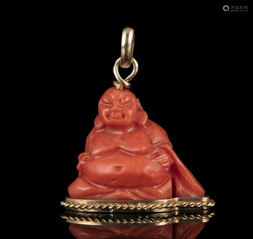 $ A GOLD MOUNTED CORAL ‘BUDAI’ OR ‘PUTAI’ PENDANT IN THE MAN...