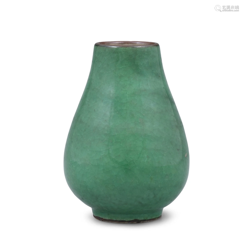 AN APPLE-GREEN GLAZED PORCELAIN VASE OF ARCHAISTIC HU SHAPE ...