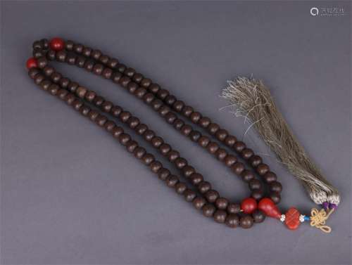 A STRING OF 108 BUDDHIST BEADS OF OLD ALOES IN THE QING DYNA...