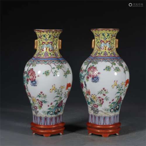 A PAIR OF WALL HANGING VASES PAINTED WITHGOLD AND FLOWERS IN...