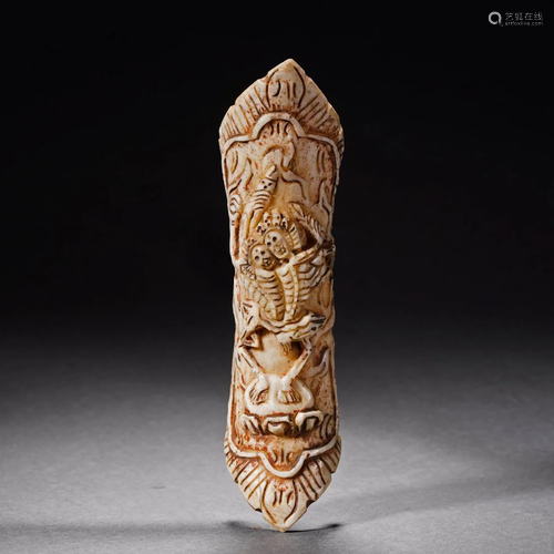 A Tibetan Carved Bone Amulet