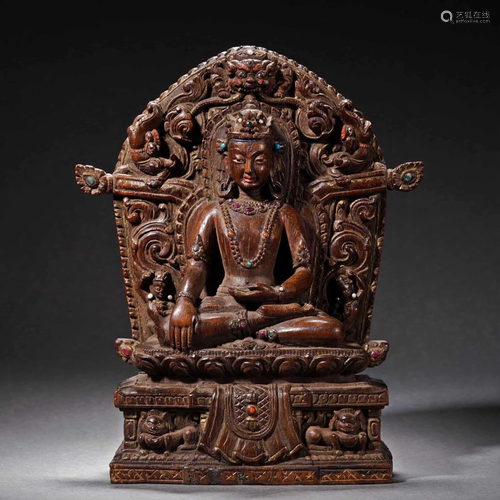 A Tibetan Carved Rosewood Figure of White Tara