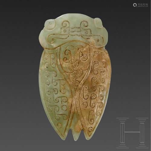 A Chinese jade pendant in the shape of a cicada, circa 1900