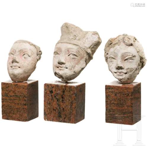 Three stucco heads, Middle Asian, 2nd - 3rd century