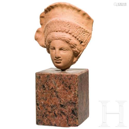 A terracotta head of a woman with diadem, 3rd- 2nd century B...