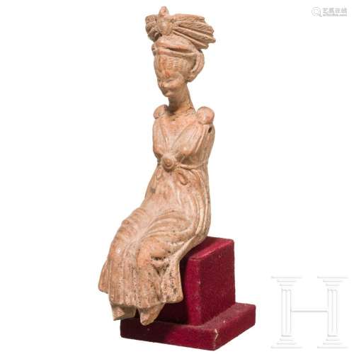 A Hellenistic terracotta of a sitting woman, 2nd - 1st centu...