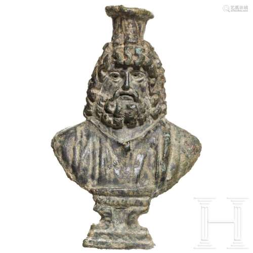 A Roman bronze fitting in the shape of a Serapis bust, 1st -...