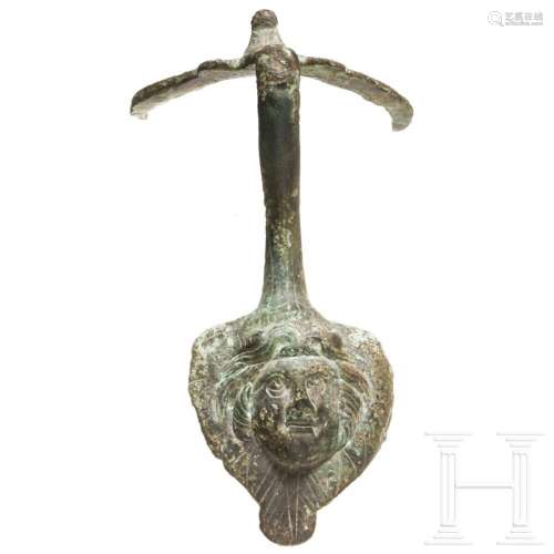 A Roman bronze handle attachment of a jug, 2nd - 3rd century