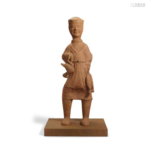 A LARGE POTTERY FIGURE OF A BOY HOLDING A DUCK AND FISH Han ...