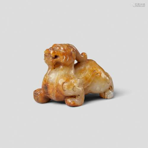 A SMALL HAN-STYLE RUSSET JADE FIGURE OF A MYTHICAL BEAST