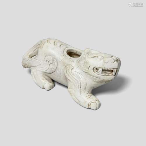 AN ARCHAISTIC 'CHICKEN BONE' JADE WATERPOT IN THE FORM OF A ...