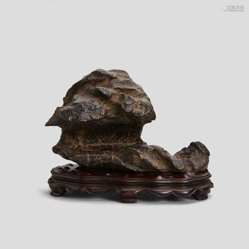 A GRAY INSCRIBED HORIZONTAL SCHOLAR'S ROCK  Late Qing dynast...