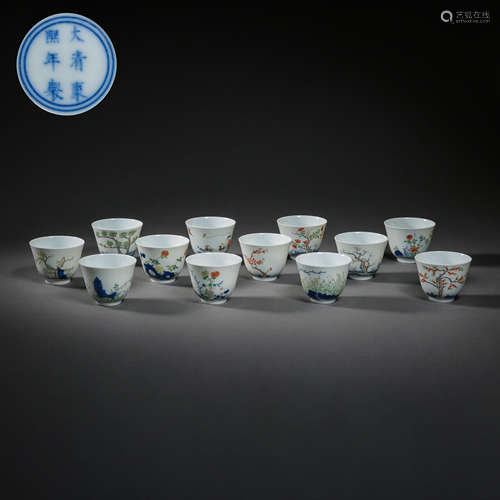 TWELVE CHINESE QING DYNASTY KANGXI FAMILLE ROSE CUPS