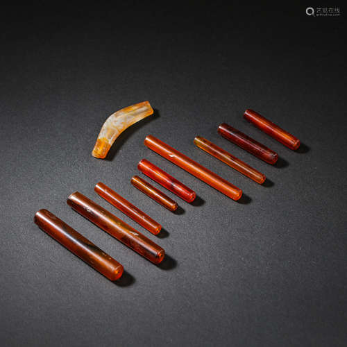 A GROUP OF CHINESE AGATE ACCESSORIES FROM THE WESTERN ZHOU D...