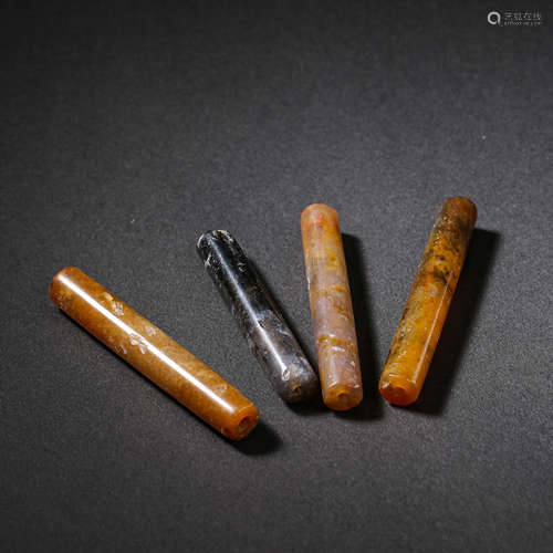 A GROUP OF CHINESE AGATE ACCESSORIES FROM THE WESTERN ZHOU D...