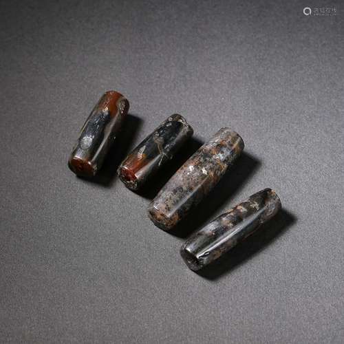 A GROUP OF CHINESE AGATE ACCESSORIES FROM THE WESTERN ZHOU D...