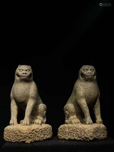 A PAIR OF CHINESE STONE SITTING LIONS, TANG DYNASTY