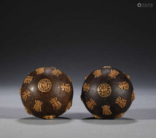 In the Qing Dynasty, a pair of aloes wood inlaid longevity b...