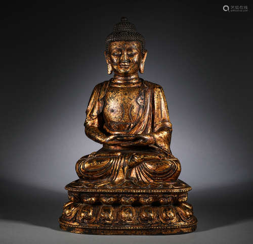 The bronze gilded statue of Sakyamuni Buddha in the Ming Dyn...