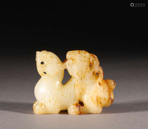 In the Qing Dynasty, there were two animal ornaments made of...