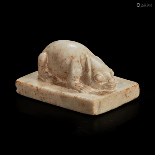 A Chinese white marble figure of a crouching rabbit Tang dyn...