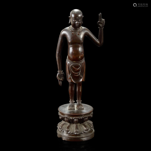 A Chinese bronze figure of the infant Buddha Ming dynasty