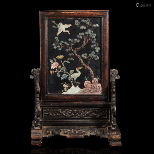 A Chinese embellished lacquer and carved hardwood table scre...
