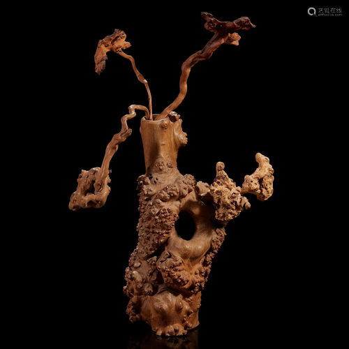 A burl wood vase of "Flowers"