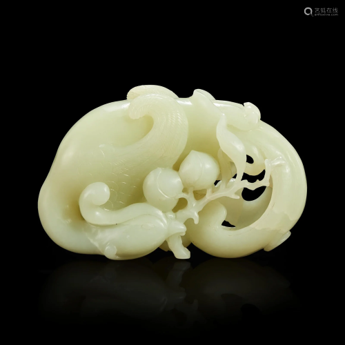 A Chinese carved white jade "Phoenix and Peach" la...