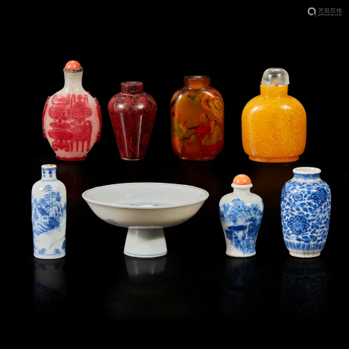 Seven assorted glass, porcelain snuff bottles; a vase; and a...