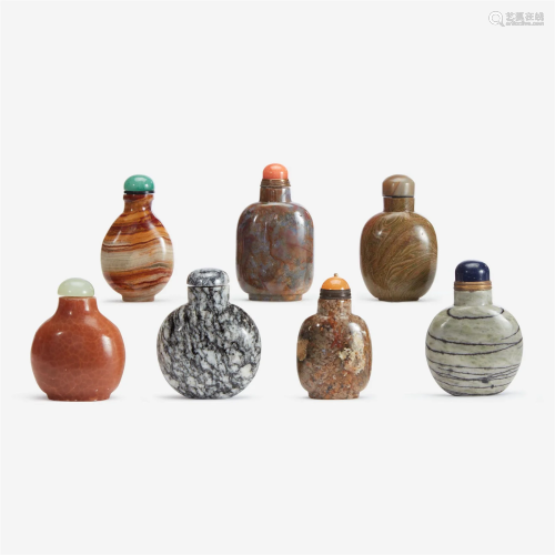 An assorted group of seven Chinese hardstone snuff bottles