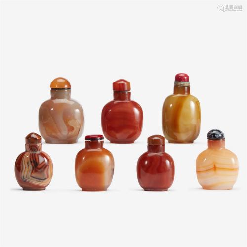 An assorted group of seven Chinese carnelian and agate snuff...