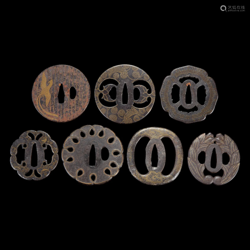 Group of seven Japanese inlaid iron tsuba Edo period or earl...