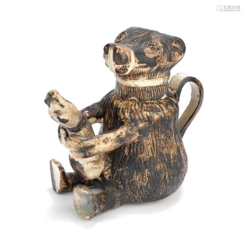 A creamware bear baiting jug and cover, circa 1780-90