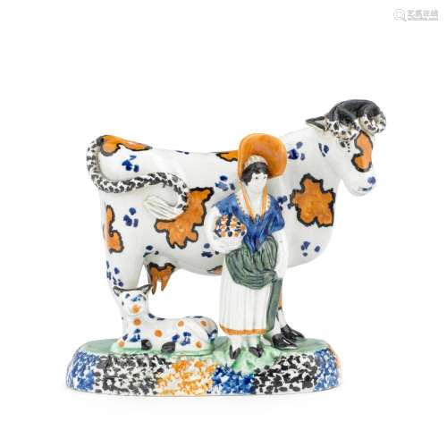 A good Yorkshire Prattware cow and figure group, circa 1820