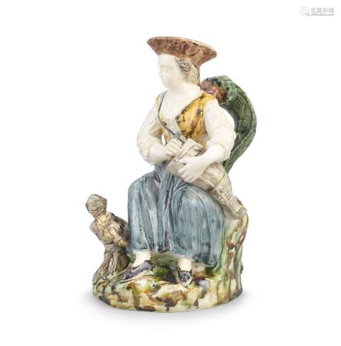 【*】A very rare creamware figural Toby Jug,  circa 1800