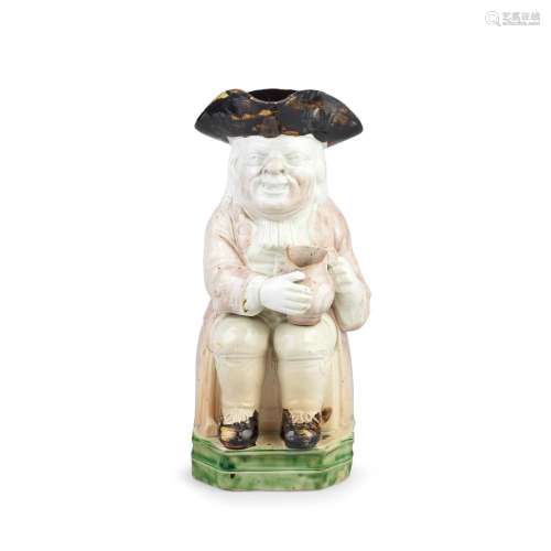 【*】A Staffordshire pearlware 'Double Base' Toby Jug, circa 1...