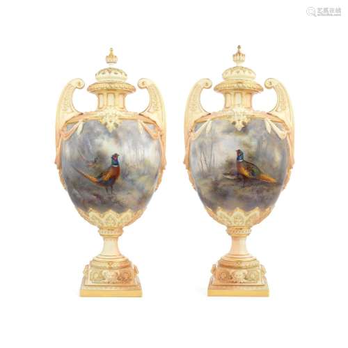 An impressive pair of Royal Worcester vases and covers by Ja...