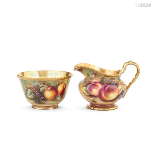 A Royal Worcester 'Painted Fruit' milk jug and sugar bowl by...