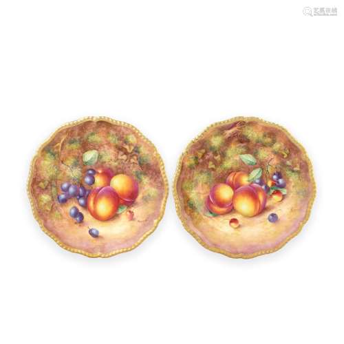 A pair of Royal Worcester 'Painted Fruit' plates by John Fre...