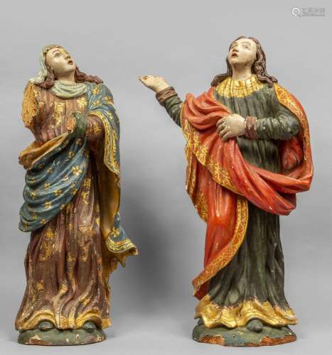 Sante, coppia di sculture in legno intagliato,